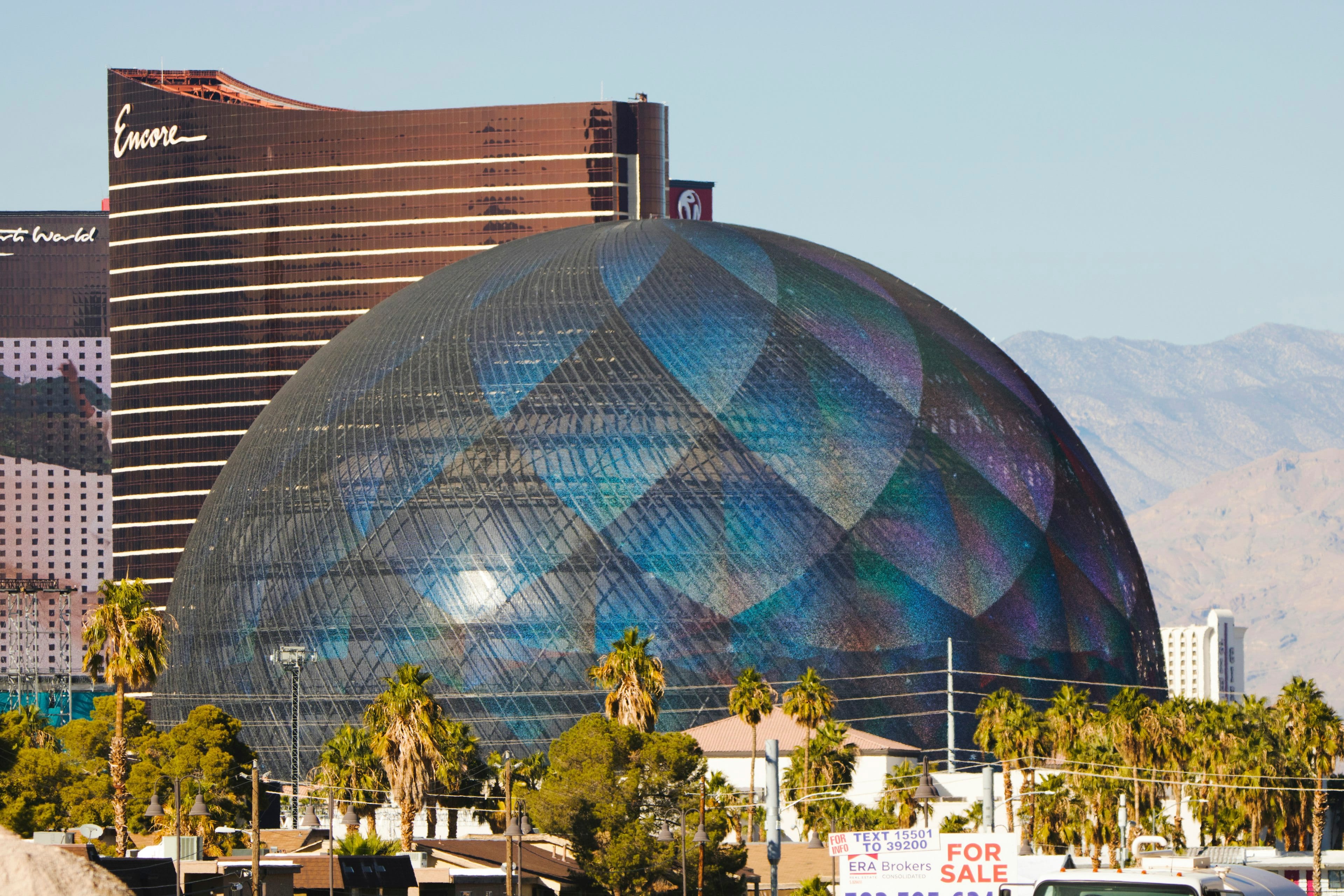 The Sphere glowing over the Las Vegas skyline at night